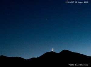 Triple planetary conjunction of Venus, Mars, and Saturn along with the crescent moon.
