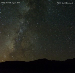 Perseid meteor streaks across the Milky Way with the San Francisco Peaks on the horizon.