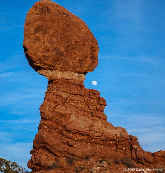 Moonrise behind Balanced Rock, Arches National Park.