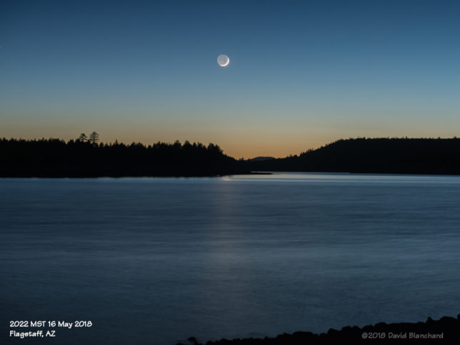 A thin crescent Moon above Lake Mary.