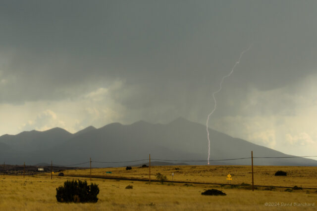 Lightning on the north side of the San Francisco Peak showing the landing point of the bolt.