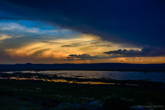 Sunset colors on thunderstorms and anvil clouds.