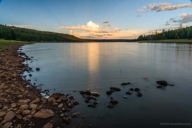 A pre-Moon rise, long-exposure shot of the lake and distant clouds.