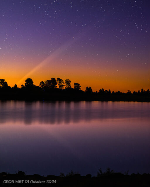 The tail of the comet is reflected in the still waters of Lake Ashurt, near Flagstaff, Arizona. (01 October 2024)