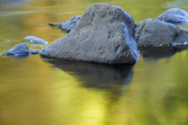 Late afternoon colors are reflected in the waters of Oak Creek.